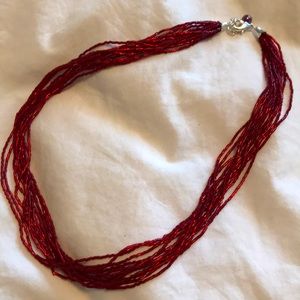 Garnet red multi-strand beaded necklace.